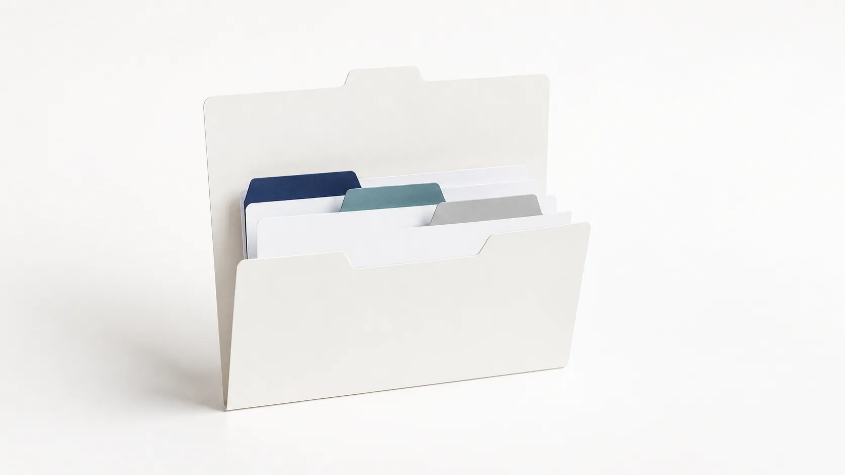 Single organised folder with tabbed dividers on a white desk — building an effective AI knowledge base for customer service
