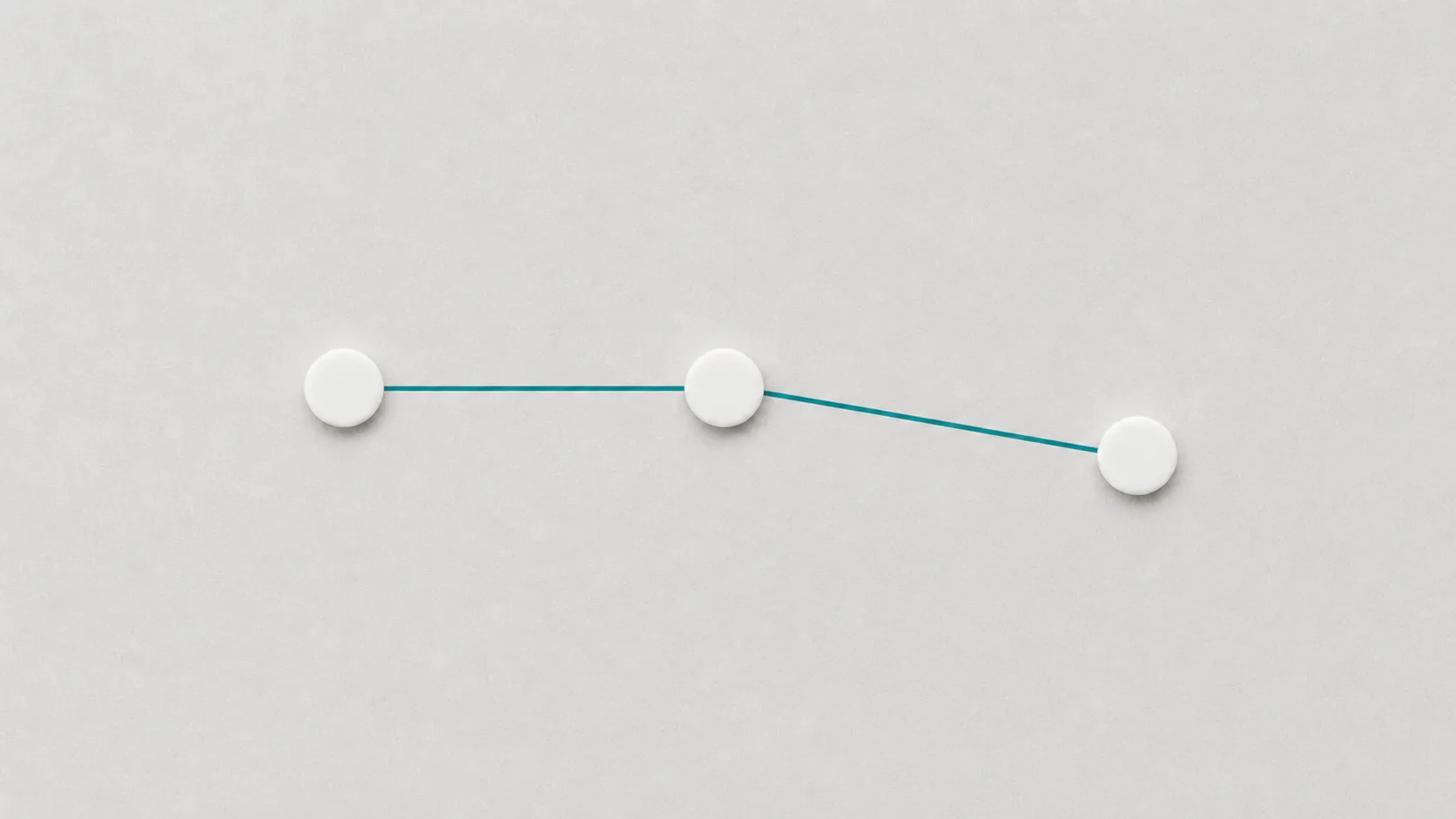 Simple flowchart with three connected nodes on a white surface — designing AI conversation flows that convert